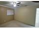 Bedroom featuring neutral walls, carpet, and a ceiling fan, creating a serene and cozy atmosphere at 7629 Chapelhill Dr, Orlando, FL 32819