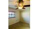 A clean, bright bedroom featuring modern flooring and large window to maximize natural light at 7629 Chapelhill Dr, Orlando, FL 32819