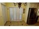Breakfast Nook adjacent to kitchen with white shutters, chandelier, and stainless refrigerator at 7629 Chapelhill Dr, Orlando, FL 32819