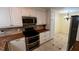 Kitchen featuring modern appliances and ample cabinet space at 7629 Chapelhill Dr, Orlando, FL 32819