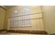 Second floor landing featuring a white railing and shuttered windows at 7629 Chapelhill Dr, Orlando, FL 32819
