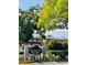 Sandpointe community signage and entrance with lush landscaping and Mediterranean architecture at 7629 Chapelhill Dr, Orlando, FL 32819