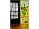 Entryway featuring decorative stained glass with a desert motif at 7629 Chapelhill Dr, Orlando, FL 32819