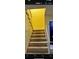 Carpeted staircase with wooden railing leading to the upper level at 7629 Chapelhill Dr, Orlando, FL 32819
