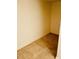 Practical and accessible tiled storage space with clean lines and neutral tones, adding functionality to the home at 7629 Chapelhill Dr, Orlando, FL 32819