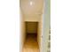 A convenient, tiled storage space or closet near the stairs offers practicality and easy access at 7629 Chapelhill Dr, Orlando, FL 32819