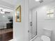 Bright bathroom with a glass shower, tiled walls, and classic fixtures at 901 Golfside Dr, Winter Park, FL 32792