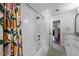Bright bathroom featuring marble counters and a shower-tub combination with a colorful curtain at 901 Golfside Dr, Winter Park, FL 32792