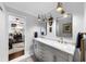 Elegant bathroom featuring a double vanity, marble countertops, and modern lighting at 901 Golfside Dr, Winter Park, FL 32792