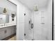 Modern bathroom with a glass shower, tiled walls, and updated hardware at 901 Golfside Dr, Winter Park, FL 32792