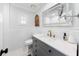 Modern bathroom with a gray vanity, gold hardware, and stylish fixtures at 901 Golfside Dr, Winter Park, FL 32792