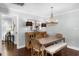 Dining room with hardwood floors, a wooden table, a chandelier, and neutral wall paint at 901 Golfside Dr, Winter Park, FL 32792