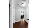 Hallway with natural light and hardwood flooring that connects to the rest of the home at 901 Golfside Dr, Winter Park, FL 32792