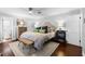 Bright main bedroom with neutral walls, a woven bench, and attractive decor at 901 Golfside Dr, Winter Park, FL 32792