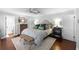 Comfortable main bedroom with hardwood floors, neutral decor, and a ceiling fan at 901 Golfside Dr, Winter Park, FL 32792