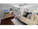Serene main bedroom with hardwood floors, a ceiling fan, and soft, natural lighting at 901 Golfside Dr, Winter Park, FL 32792