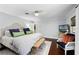 Relaxing main bedroom featuring a woven bench, stylish chair, and serene decor at 901 Golfside Dr, Winter Park, FL 32792