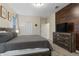 Comfortable bedroom with a wood accent wall, neutral tones, and a relaxing atmosphere at 905 Ocean Course Ave, Davenport, FL 33896