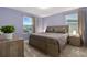 Relaxing bedroom with light purple walls, modern furniture, and lots of natural light at 905 Ocean Course Ave, Davenport, FL 33896