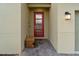 The front door shows contemporary style, highlighted by stone accents, unique bench, and brick pathway at 905 Ocean Course Ave, Davenport, FL 33896