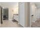 Hallway featuring easy access to bedroom and bathroom with neutral color scheme and wood doors at 905 Ocean Course Ave, Davenport, FL 33896