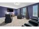 Movie room with tiered seating, large screen TV and oversized leather recliners for the ultimate viewing experience at 905 Ocean Course Ave, Davenport, FL 33896