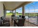 Outdoor lanai featuring a dining table with seating and overlooking the pool and spa at 905 Ocean Course Ave, Davenport, FL 33896