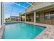 A beautiful screened-in pool with a patio and plenty of room to relax and entertain at 905 Ocean Course Ave, Davenport, FL 33896