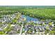 Scenic aerial view of a home near a lake in a neighborhood with lush green spaces at 931 Croton Rd, Celebration, FL 34747
