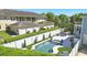 Aerial view showcases a backyard pool, garage, and lush landscaping, enhancing the property's appeal at 931 Croton Rd, Celebration, FL 34747