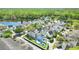 A scenic aerial view of a residential area near a lake, highlighting the home with pool at 931 Croton Rd, Celebration, FL 34747