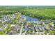 Scenic aerial view of a highlighted home near a lake in a beautiful neighborhood at 931 Croton Rd, Celebration, FL 34747