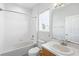 A full bathroom offering a tub-shower combo, a single sink vanity, and a white color scheme at 931 Croton Rd, Celebration, FL 34747