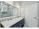 Stylish bathroom with double sinks, modern fixtures, and a glass-enclosed shower at 931 Croton Rd, Celebration, FL 34747