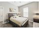 A bedroom featuring hardwood floors, a large bed, and a neutral color scheme at 931 Croton Rd, Celebration, FL 34747