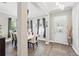 Sophisticated dining room with stylish decor, elegant lighting, and a seamless transition to the entryway at 931 Croton Rd, Celebration, FL 34747