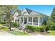 Charming home with inviting porch, decorative gable, and well-maintained landscaping at 931 Croton Rd, Celebration, FL 34747
