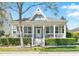 Charming home with inviting porch, decorative gable, and well-maintained landscaping at 931 Croton Rd, Celebration, FL 34747