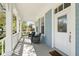 Inviting front porch with seating area, providing a cozy outdoor space to relax and enjoy the neighborhood at 931 Croton Rd, Celebration, FL 34747