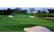Lush green golf course with sand traps and a charming clubhouse in the background offering an ideal spot for recreation at 931 Croton Rd, Celebration, FL 34747