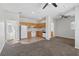 A living room with a combination of carpeted and tiled flooring with natural light at 931 Croton Rd, Celebration, FL 34747