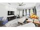 Bright living room featuring a large TV, comfortable seating, and ample natural light at 931 Croton Rd, Celebration, FL 34747