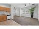 A living room with a combination of carpeted and tiled flooring with natural light at 931 Croton Rd, Celebration, FL 34747