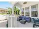 Inviting porch with comfortable seating, perfect for relaxing outdoors with a cool overhead fan at 931 Croton Rd, Celebration, FL 34747