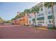 Charming street view lined with colorful buildings, palm trees, and sidewalks, creating a vibrant atmosphere at 931 Croton Rd, Celebration, FL 34747