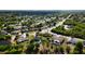 Expansive aerial view of the neighborhood, showcasing lush landscaping and inviting community at 1060 Elkcam Blvd, Deltona, FL 32725