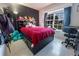 Bright bedroom with a dark accent wall, large window, and a comfortable bed at 1060 Elkcam Blvd, Deltona, FL 32725