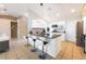 Stylish kitchen island with granite countertop, white cabinets, and stainless steel appliances at 1060 Elkcam Blvd, Deltona, FL 32725