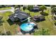 Aerial shot of a house featuring a backyard with a pool, deck, shed, and screened porch at 1060 Elkcam Blvd, Deltona, FL 32725