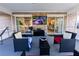 The screened-in porch is equipped with a television and comfortable seating, perfect for relaxing and entertaining at 1060 Elkcam Blvd, Deltona, FL 32725